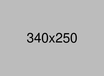 School administrator reviewing financial reports on a computer.